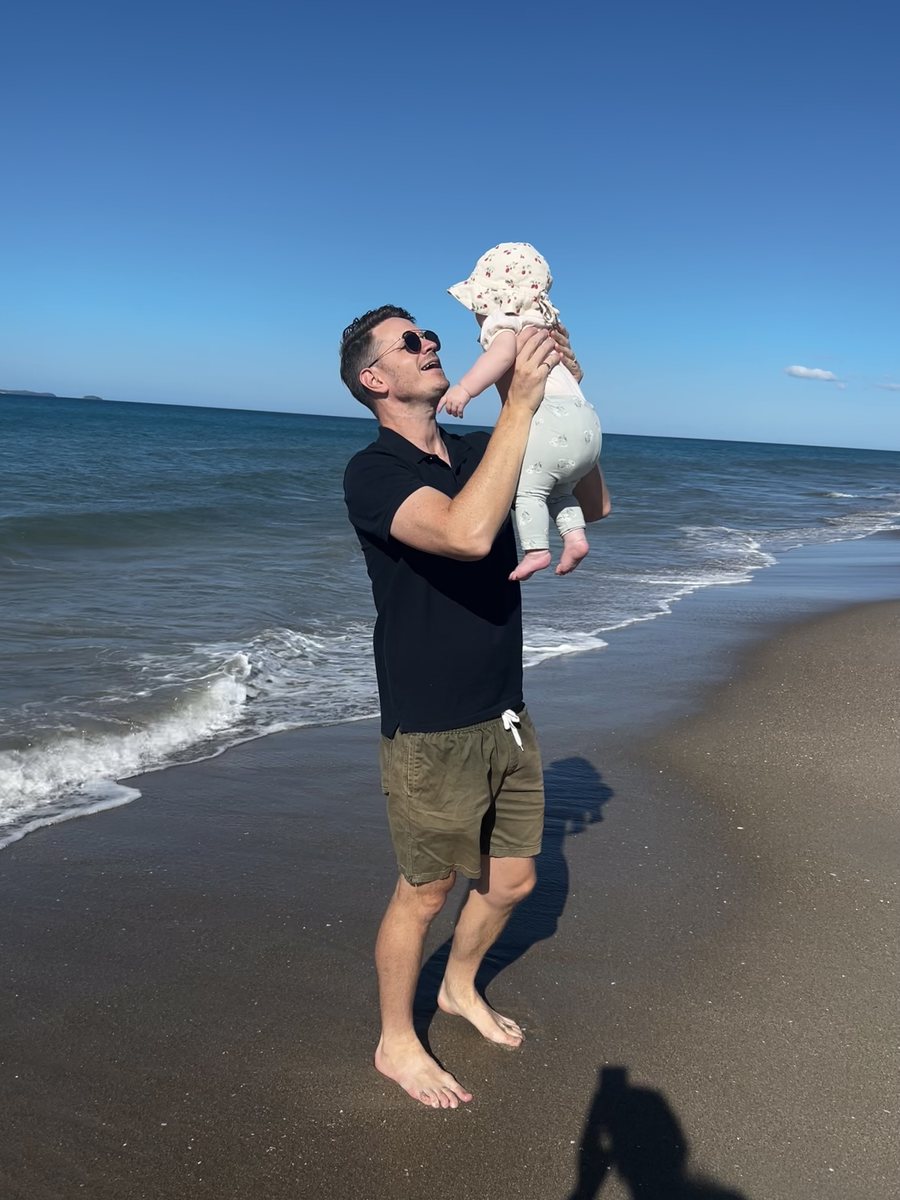 Seth Rackham on Papamoa beach with his daughter